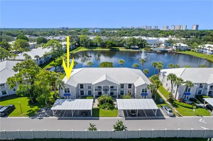 Drone / aerial view of property and Vanderbilt Beach 1 mile away