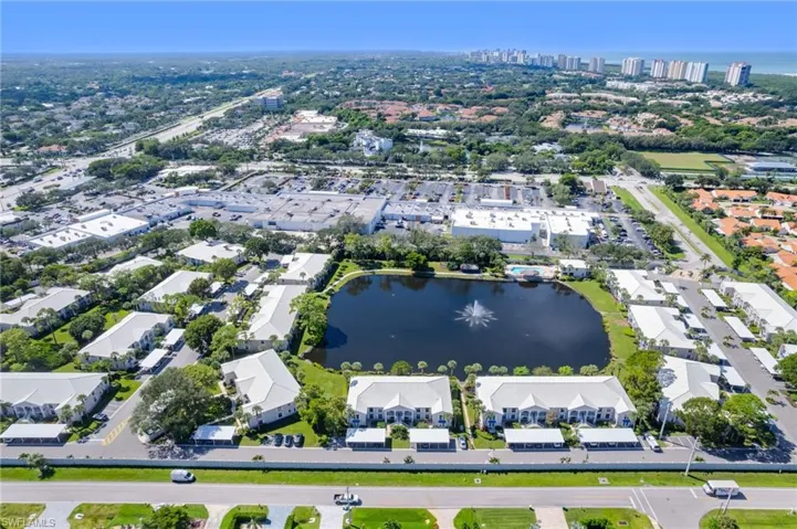 View of property location featuring pond and Vanderbilt Beach 1 mile away