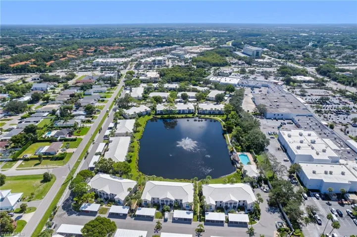Bird's eye view of a surrounding residential and shopping areas.