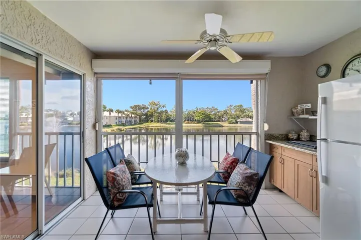Lanai with a pond view and fountain feature.