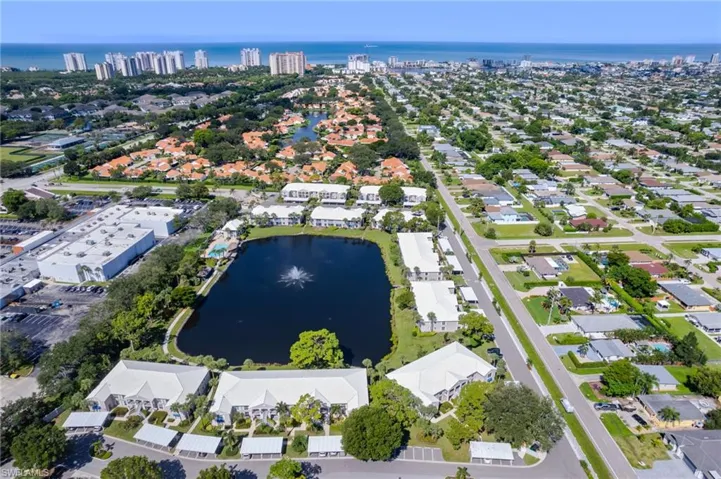 View of property location with a large body of water and nearby suburban area