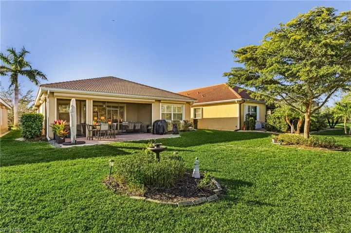 View of large covered lanai and large patio area.