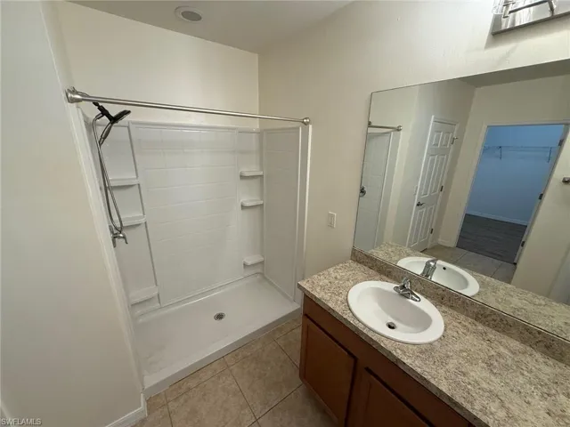 Primary Bathroom with Dual Sinks and Shower