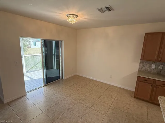 Dining Nook with Sliding Glass Door out to Lanai