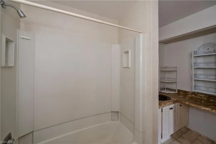 Bathroom with tile flooring and vanity