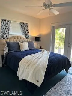 Bedroom with access to outside, french doors, and ceiling fan