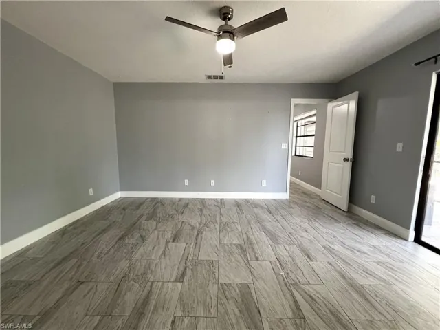 Empty room featuring ceiling fan