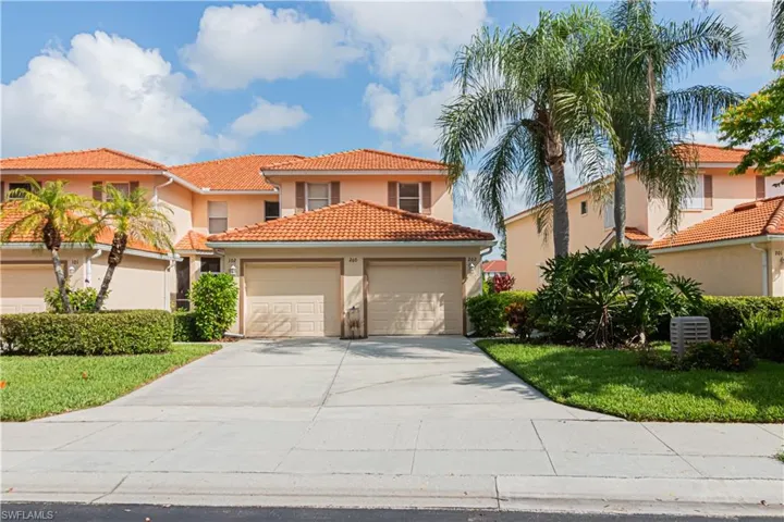 Mediterranean / spanish-style home featuring a garage, concrete driveway, stucco siding, and a tile roof