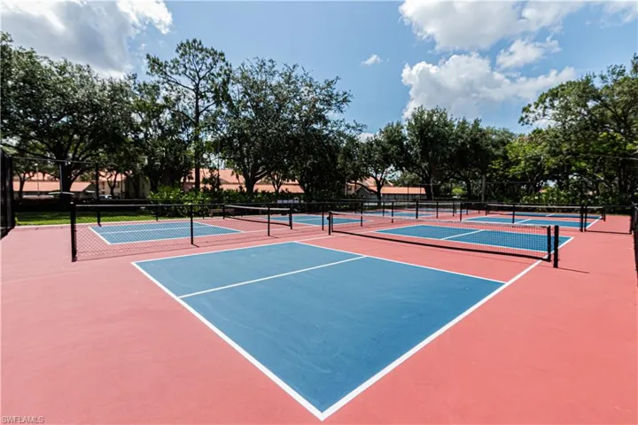 View of tennis court with community basketball court