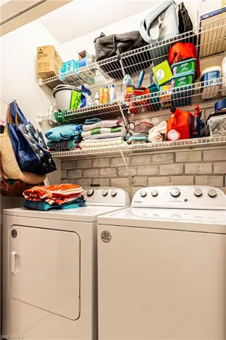 Laundry room featuring washing machine and clothes dryer