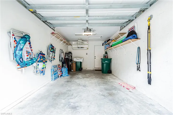 Garage featuring a garage door opener