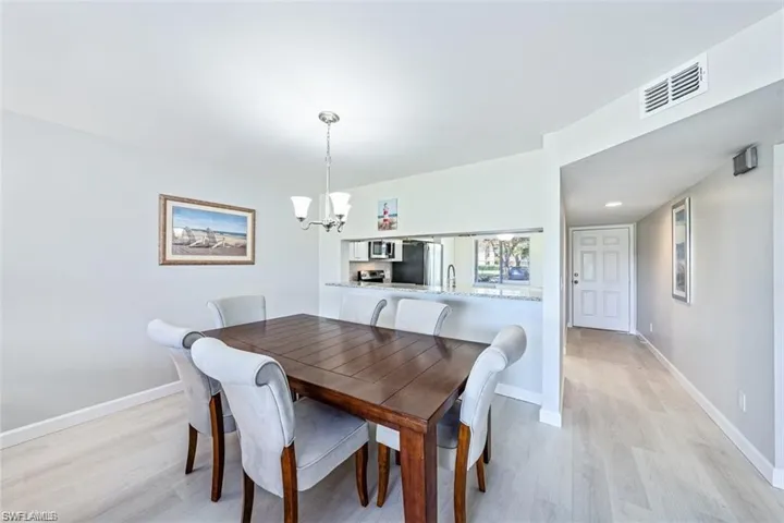Dining room featuring a chandelier and light wood-style floors