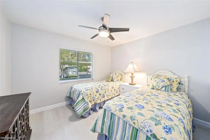 Bedroom featuring light wood-type flooring and ceiling fan