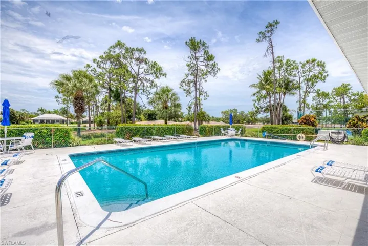 Community pool featuring a patio area