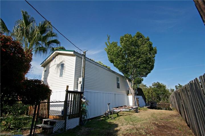 Front of home with boat ramp to the right