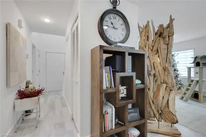 Hallway featuring baseboards and light wood finished floors