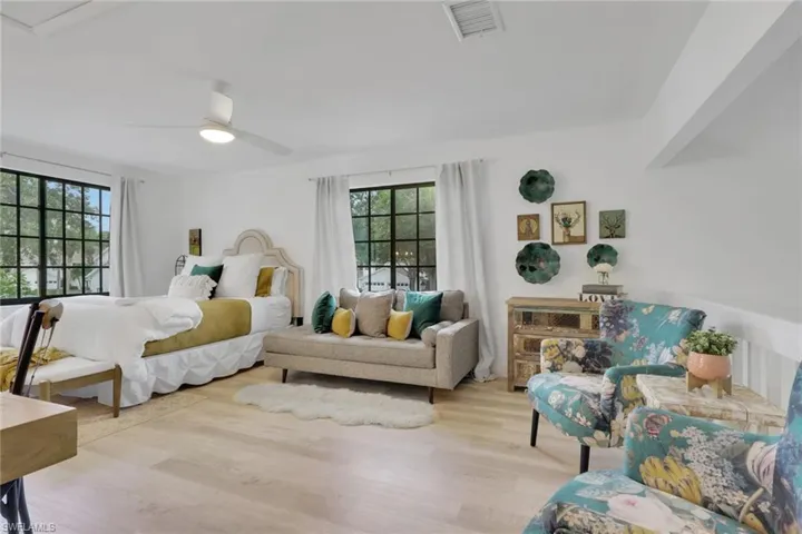 Loft featuring light wood-style flooring and ceiling fan