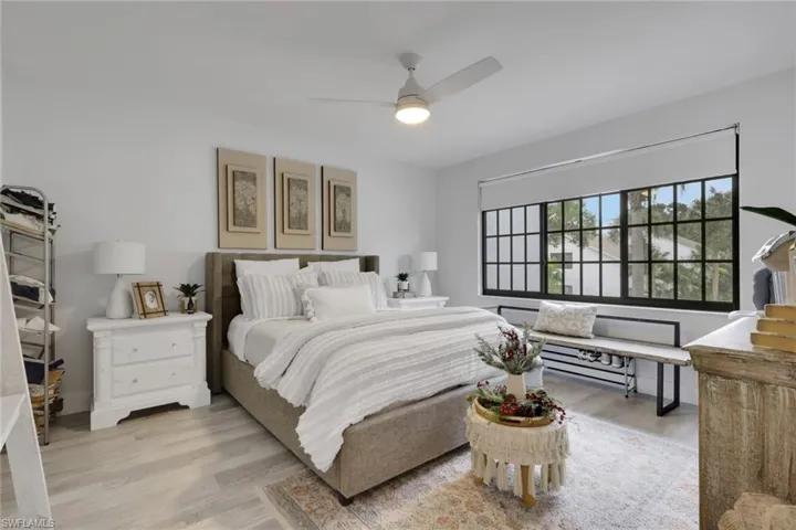 Bedroom on 2nd floor with light wood-style flooring and a ceiling fan