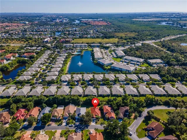 View of property location with a large body of water and nearby suburban area