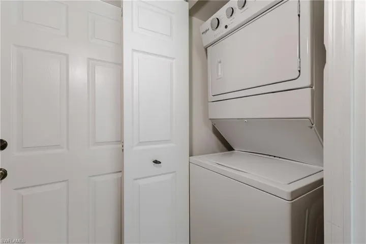 Laundry area with stacked washer / drying machine