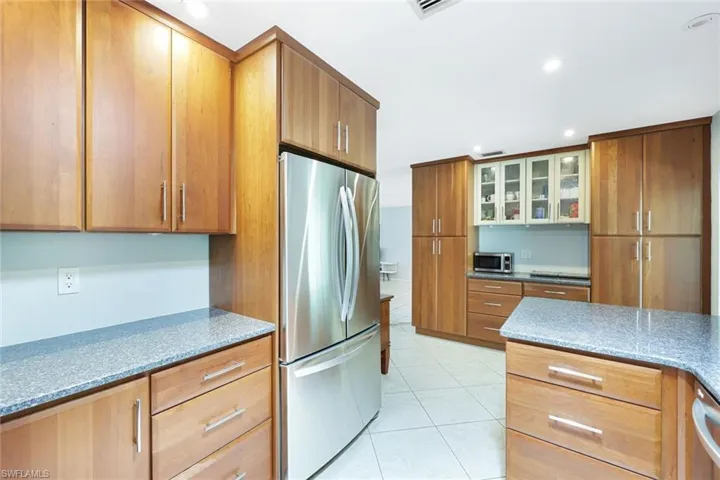 Kitchen offers ample cabinet space.