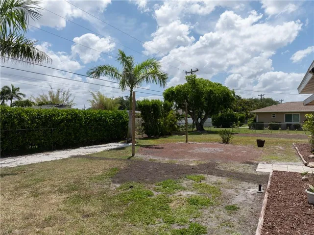 View of yard featuring fence