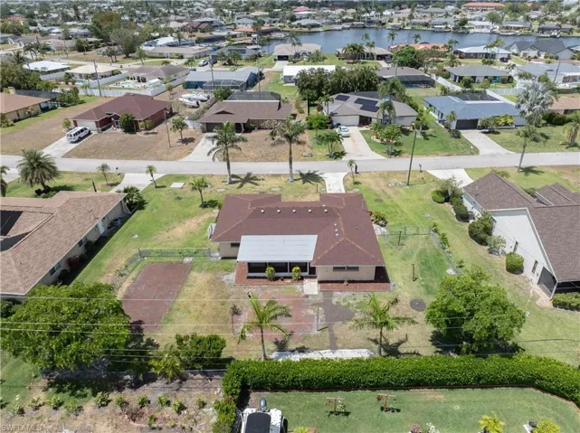 Bird's eye view featuring a water view and a residential view