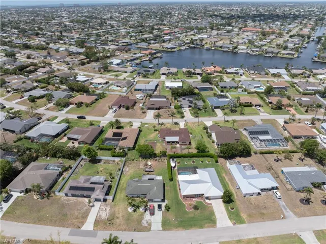 Birds eye view of property featuring a residential view and a water view