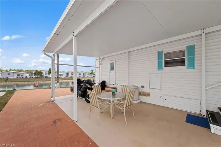 View of patio / terrace featuring outdoor dining space, a residential view, and grilling area