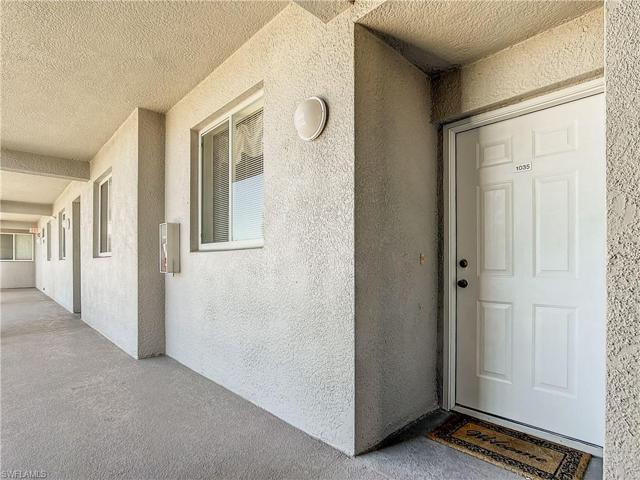 Hallway and entry door to unit 1035