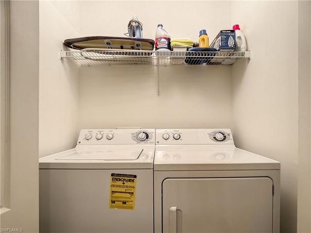 Washer and dryer enclosed in a closet in guest bath