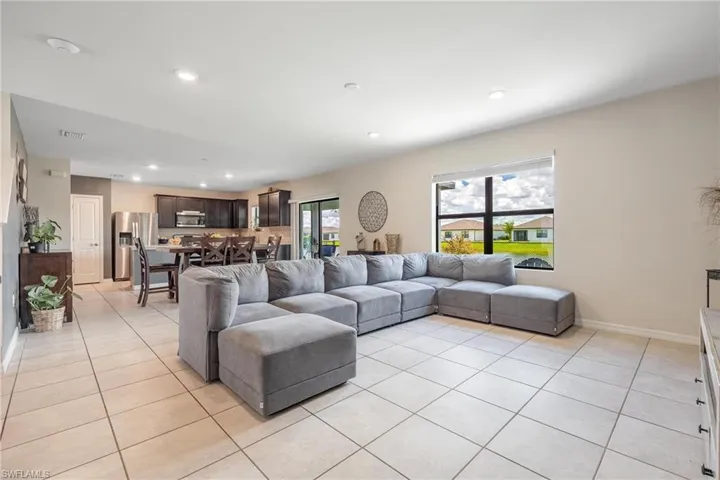 Living room featuring light tile floors