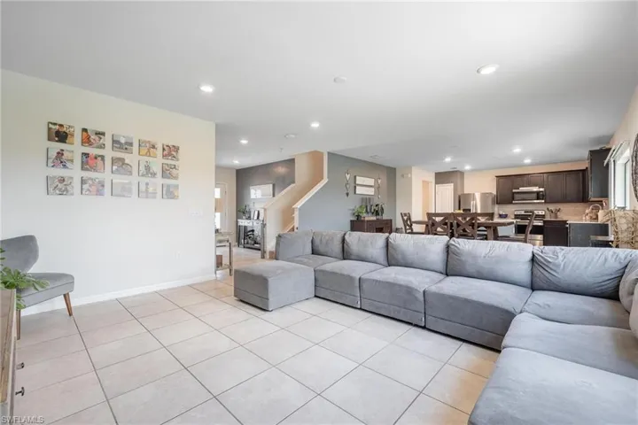 Living room featuring light tile floors