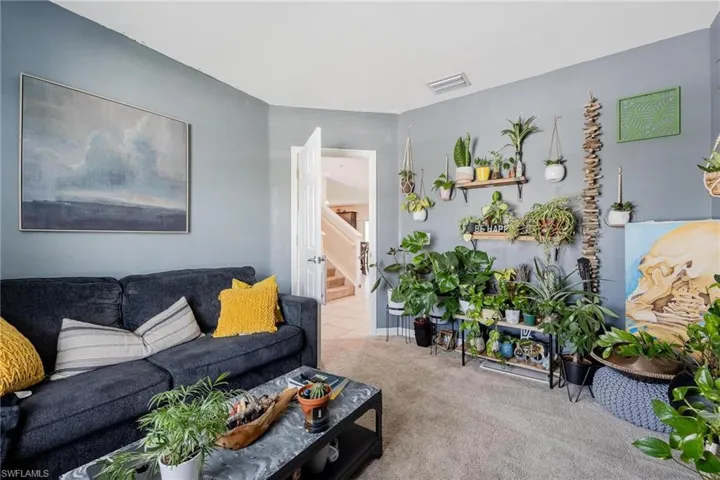 Living room featuring carpet floors