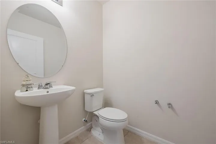 Bathroom with tile flooring and toilet