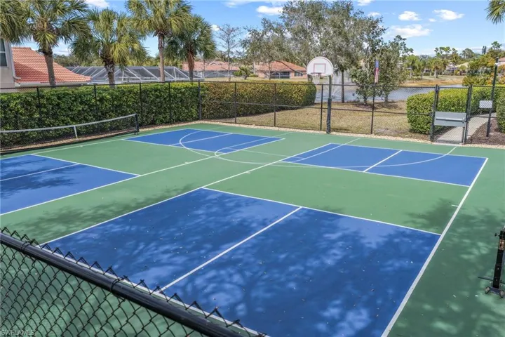 Multi-sport court featuring blue and green surfacing with white line markings