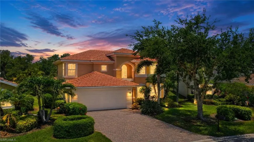 Mediterranean-inspired architecture featuring a terracotta-tiled roof and a stucco exterior