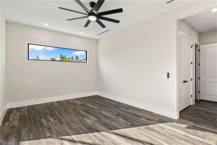 Primary bedroom with double linen closet/wardrobe, large walk in closet and spa like master bath.