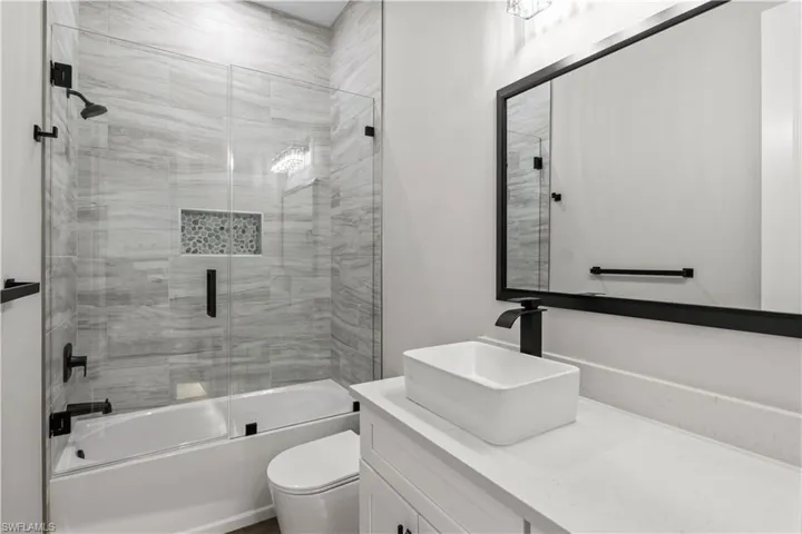 This is the bathroom shared by the secondary guest wing - bathtub and shower combo and lots of counter space!
