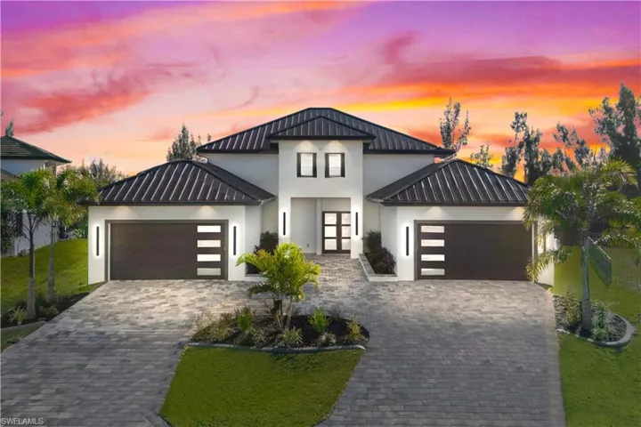 STUNNING one story contemporary warm custom home with luxury features and upgrades throughout the home.  FOUR bedrooms and a den, FOUR bathrooms and a FOUR car split garage!  All located on an oversized lot with one of the BEST access lots!