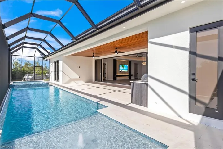 From the pool, enjoy a seamless view into the spacious living room, creating a perfect indoor-outdoor flow.