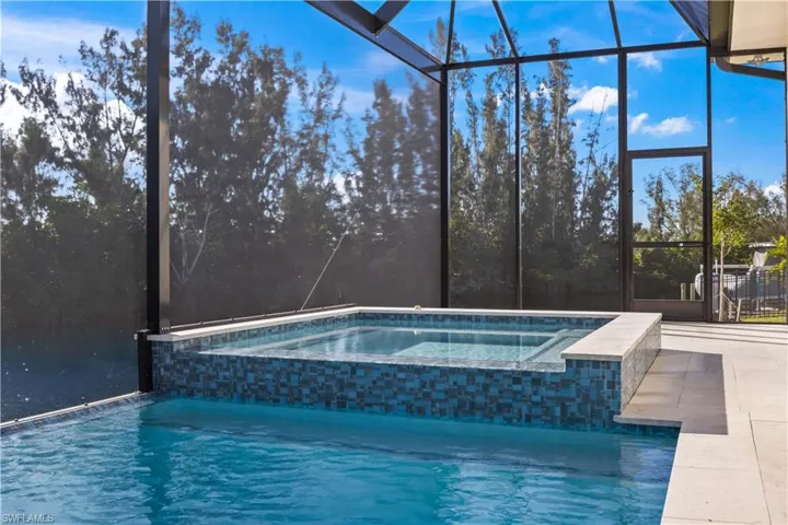 Cascading heated spa with color changes and remote controls.