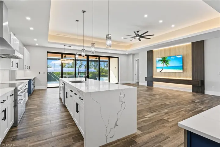 This is a WOWZA home - from the moment you enter, you will notice all the luxury details throughout including this beautiful travertine accent wall with backlighting.  The whole home was designed to be a serene and neutral palette with splasher of accents that seamlessly flow together to create this luxury yet warm feel!