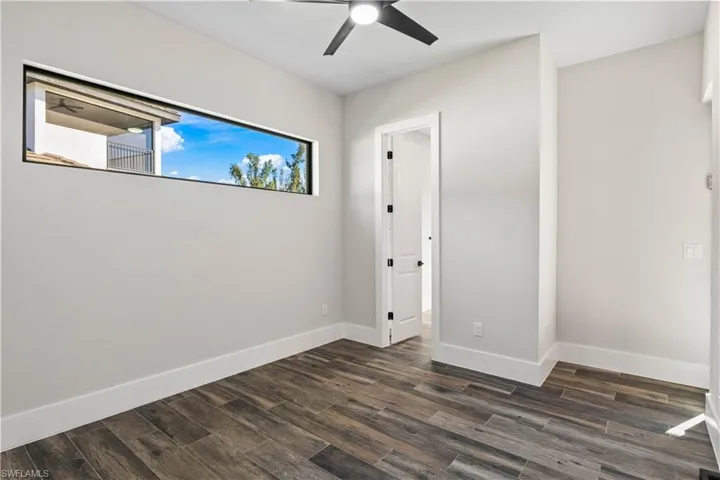 Office that could be a fifth bedroom or den - this has its own bathroom with access to the outside.  Transom window allows in natural light!