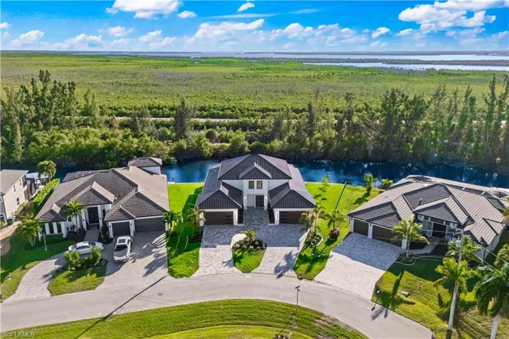 A truly magnificent design with lush landscaping, gorgeous location and 100% curb appeal!