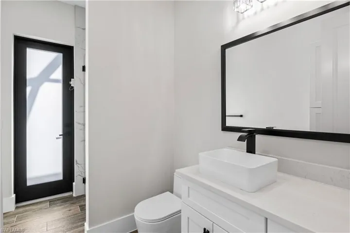 Pool bath with shower is located off the den/office for easy access to the outside!