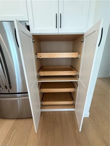 Pull out drawers in pantry cabinets.