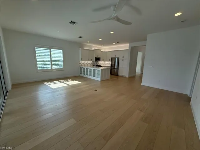 Wood flooring in main living area. Light bright and inviting!