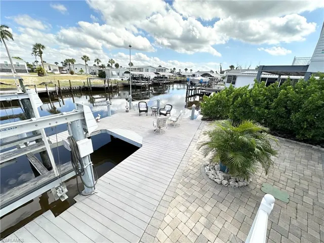 Rear patio, dock and boat lift.