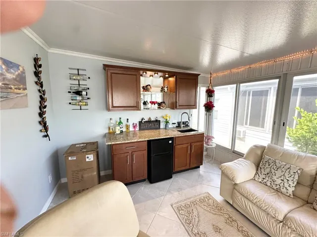 Florida room.  The bar makes this room complete.